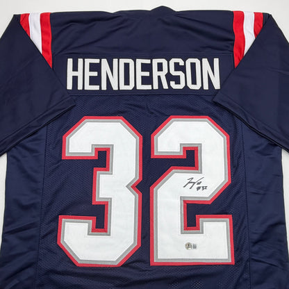Autographed/Signed TreVeyon Henderson New England Blue Football Jersey Beckett BAS COA