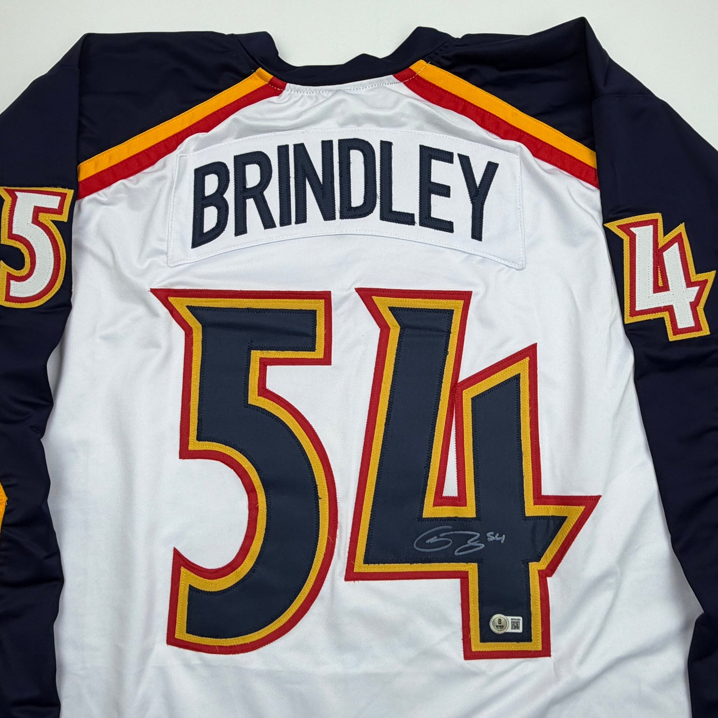 Autographed/Signed Gavin Brindley Colorado White Reverse Retro Hockey Jersey Beckett BAS COA