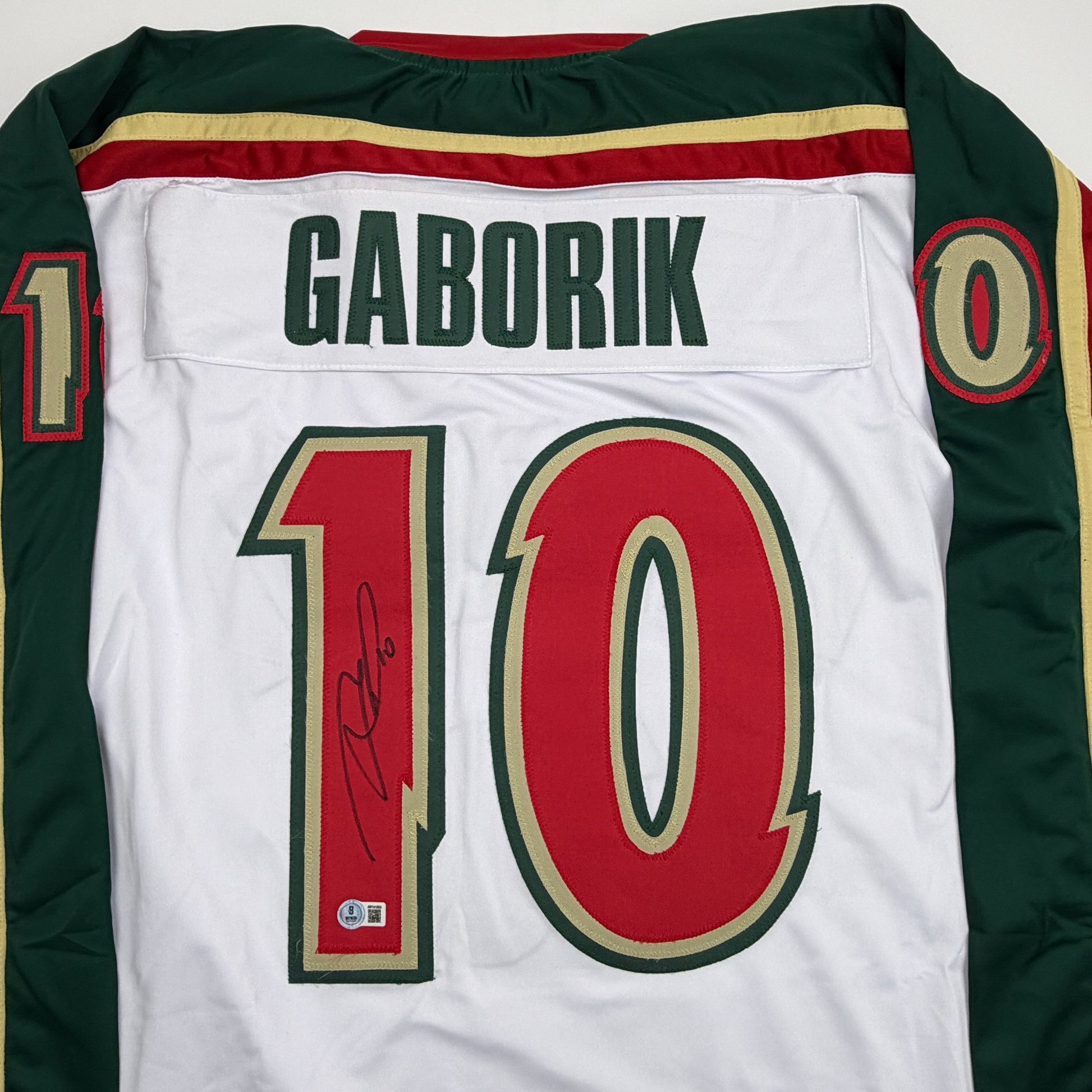 Autographed/Signed Marian Gaborik Minnesota White 25th Anniversary Hockey Jersey Beckett BAS COA