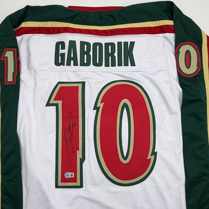 Autographed/Signed Marian Gaborik Minnesota White 25th Anniversary Hockey Jersey Beckett BAS COA