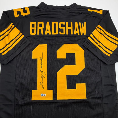 Autographed/Signed Terry Bradshaw Pittsburgh Black Color Rush Football Jersey Beckett BAS COA
