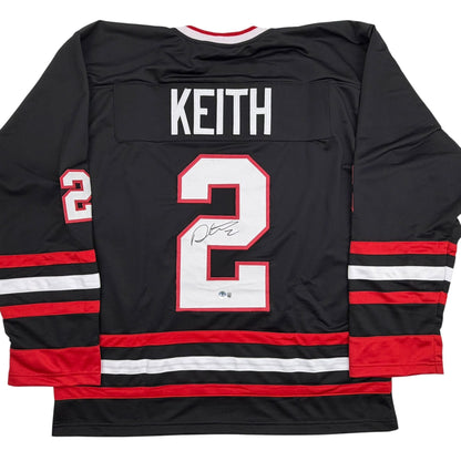 Autographed/Signed Duncan Keith Chicago Black Hockey Jersey Beckett BAS COA