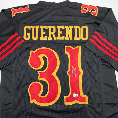 Autographed/Signed Isaac Guerendo San Francisco Black Rivalries Collection Football Jersey Beckett BAS COA