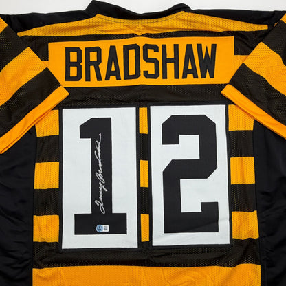 Autographed/Signed Terry Bradshaw Pittsburgh Bumble Bee Football Jersey Beckett BAS COA