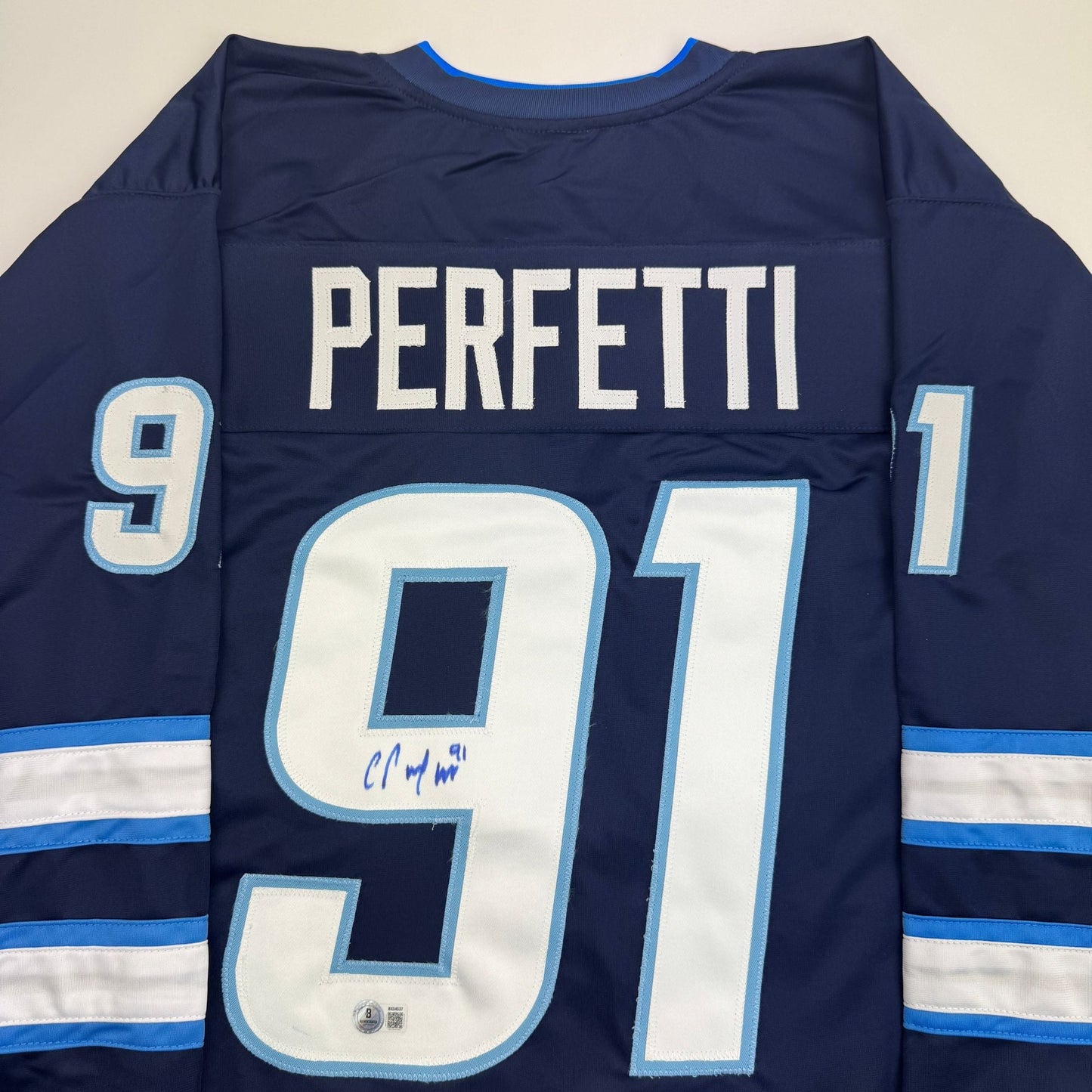 Autographed/Signed Cole Perfetti Winnipeg Blue Hockey Jersey Beckett BAS COA