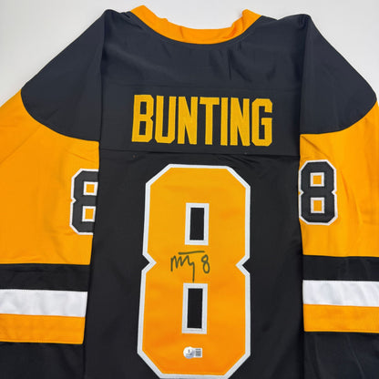 Autographed/Signed Michael Bunting Pittsburgh Black Hockey Jersey Beckett BAS COA