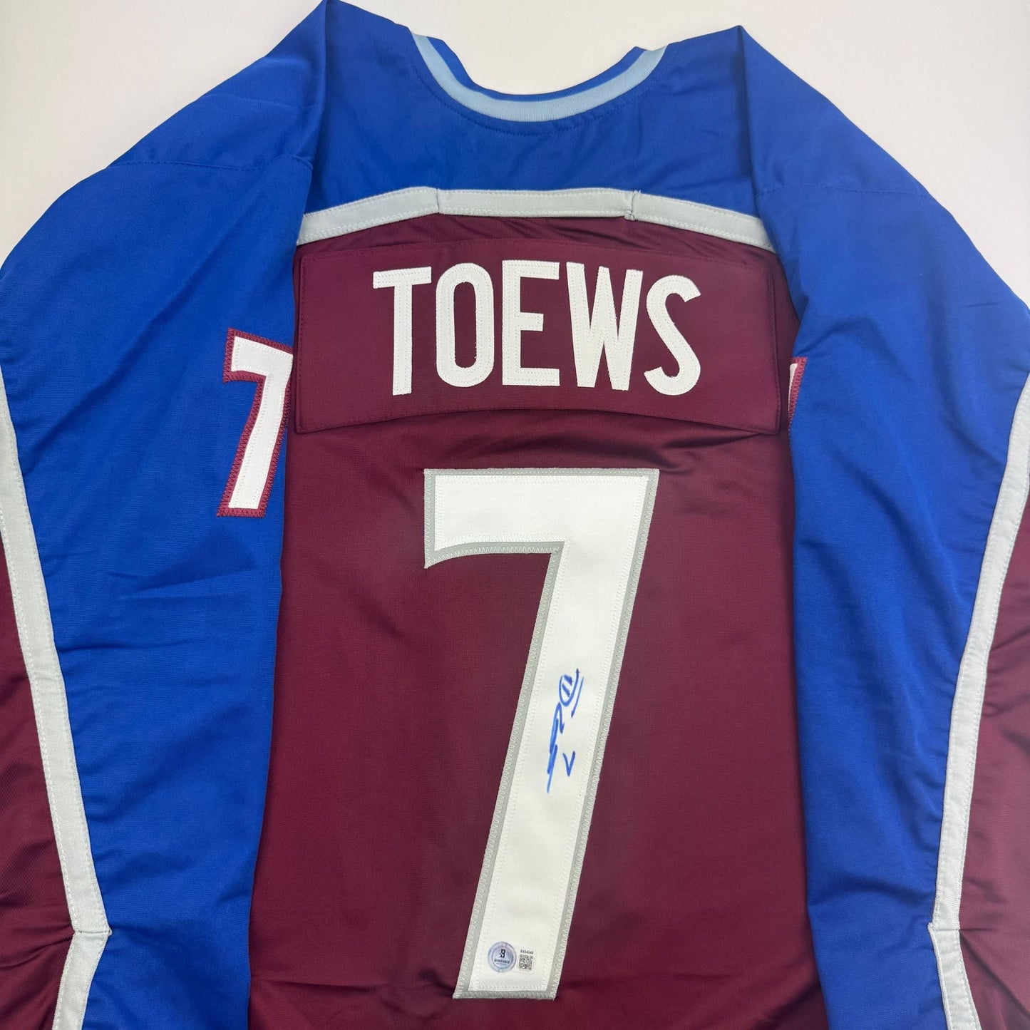 Autographed/Signed Devon Toews Colorado Maroon Hockey Jersey Beckett BAS COA