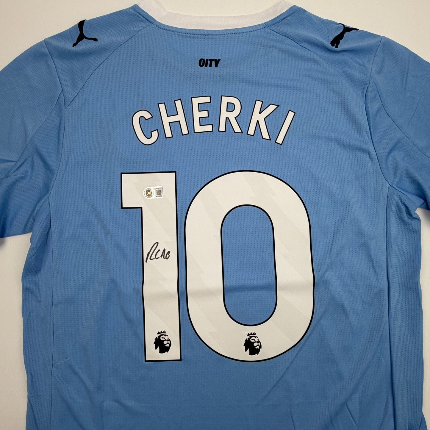 Autographed/Signed Rayan Cherki Manchester City Blue Soccer Futbol Jersey Beckett BAS COA