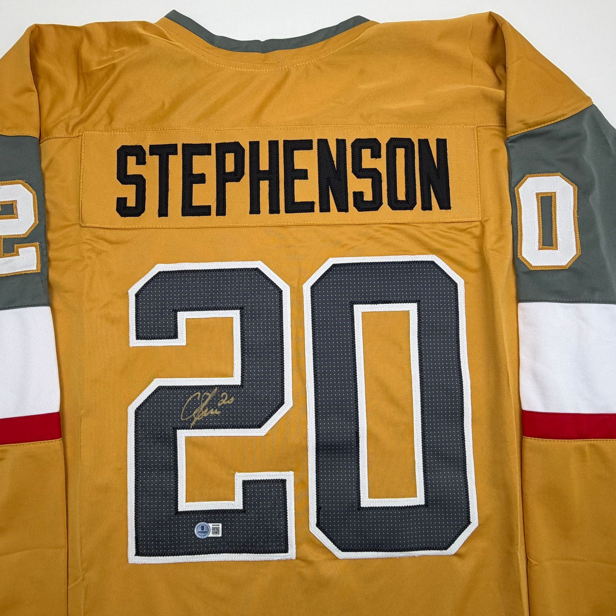 Autographed/Signed Chandler Stephenson Las Vegas Gold Hockey Jersey Beckett BAS COA