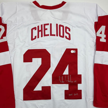 Autographed/Signed Chris Chelios Detroit White Hockey Jersey Beckett BAS COA