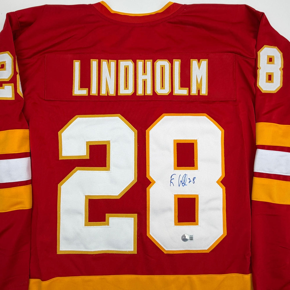 Autographed/Signed Elias Lindholm Calgary Red Hockey Jersey Beckett BAS COA
