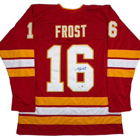 Autographed/Signed Morgan Frost Calgary Red Hockey Jersey Beckett BAS COA