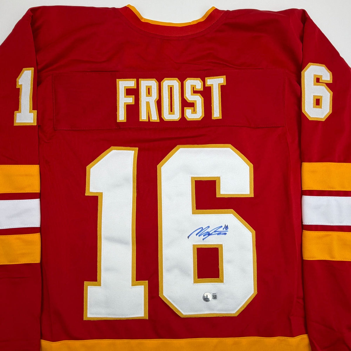 Autographed/Signed Morgan Frost Calgary Red Hockey Jersey Beckett BAS COA