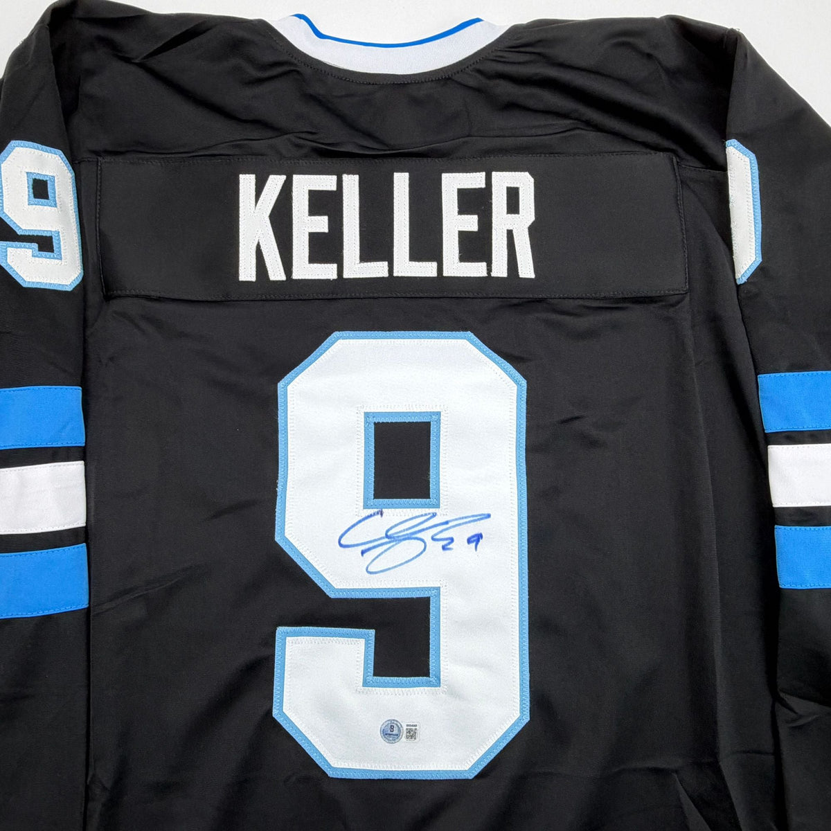Autographed/Signed Clayton Keller Utah Black Hockey Jersey Beckett BAS COA