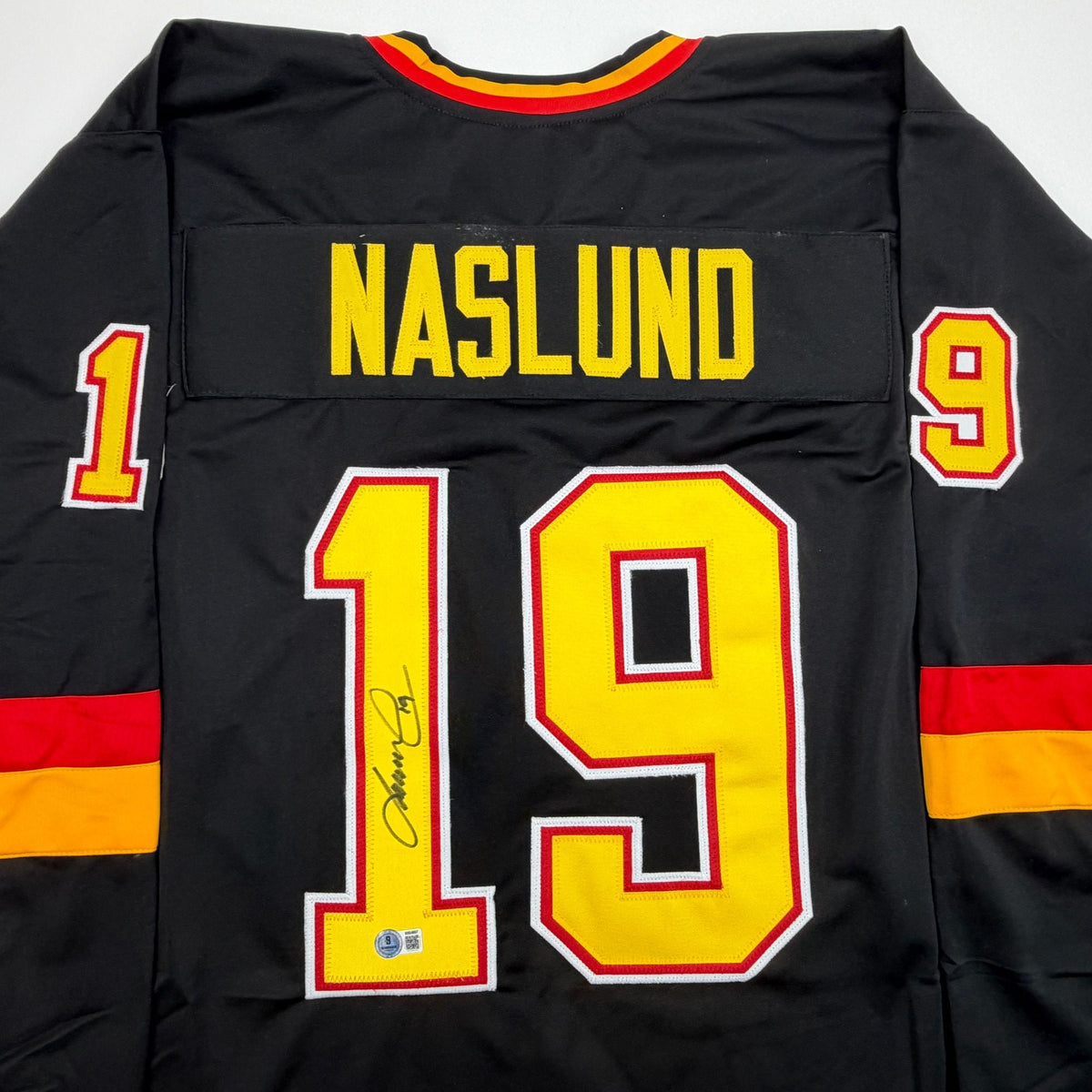Autographed/Signed Markus Naslund Vancouver Black Hockey Jersey Beckett BAS COA