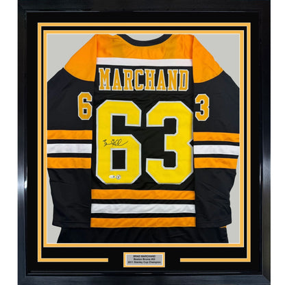 Framed Autographed/Signed Brad Marchand 35x39 Boston Black Hockey Jersey JSA COA