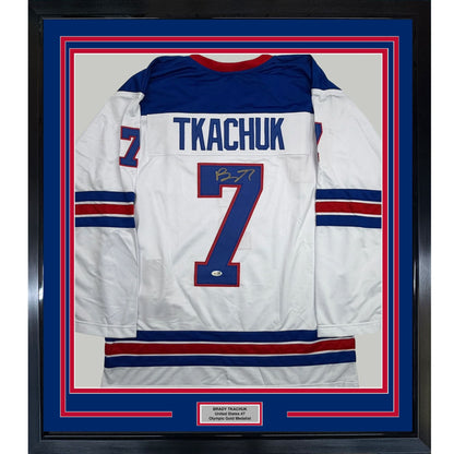 Framed Autographed/Signed Brady Tkachuk 35x39 USA United States 2026 Olympics Gold Medal White Hockey Jersey JSA COA