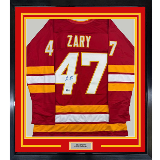 Framed Autographed/Signed Connor Zary 35x39 Calgary Red Hockey Jersey Beckett BAS COA