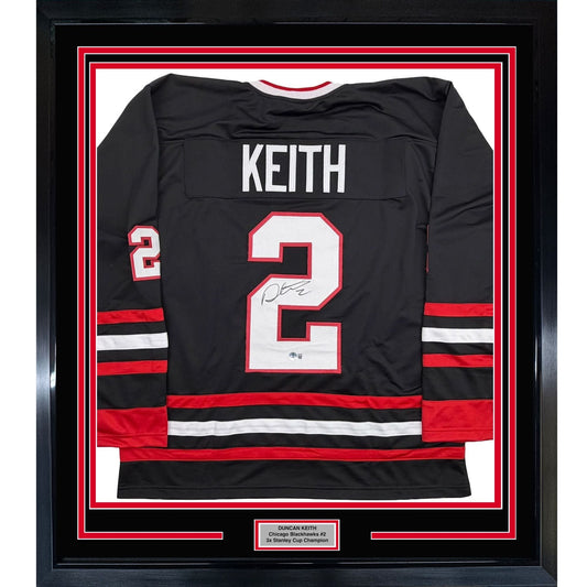 Framed Autographed/Signed Duncan Keith 35x39 Chicago Black Hockey Jersey Beckett BAS COA