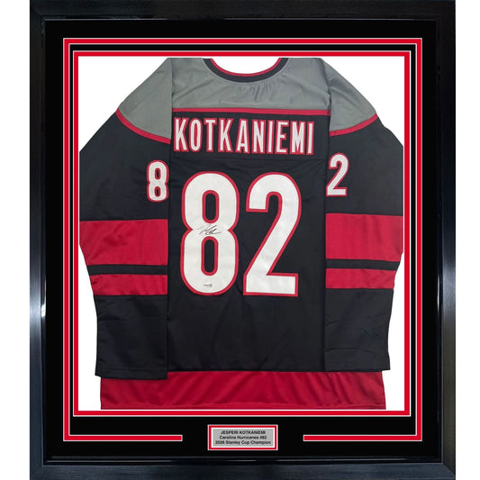 Framed Autographed/Signed Jesperi Kotkaniemi 35x39 Carolina Black Hockey Jersey Beckett BAS COA