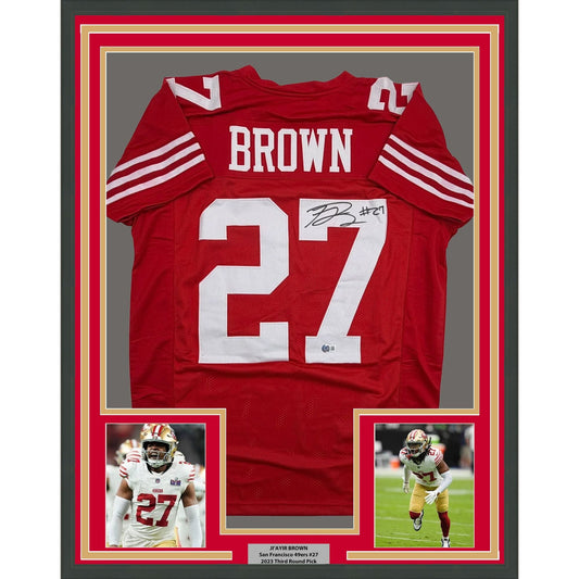 Framed Autographed/Signed Ji'Ayir Brown 35x39 San Francisco Red Football Jersey Beckett BAS COA