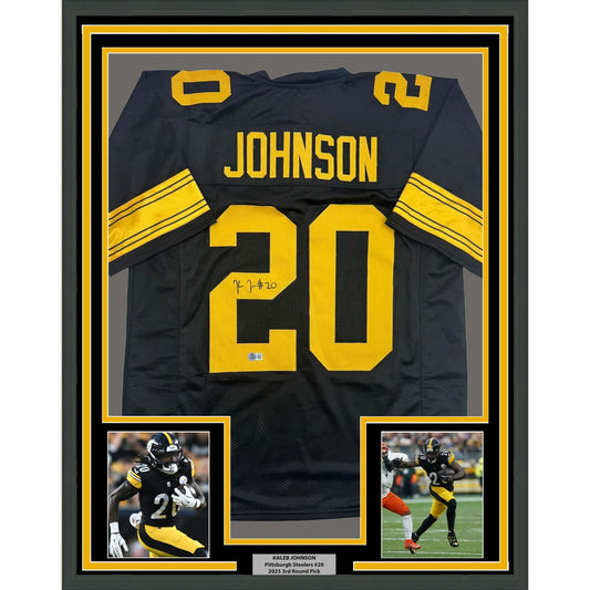 Framed Autographed/Signed Kaleb Johnson 35x39 Pittsburgh Black Color Rush Football Jersey Beckett BAS COA