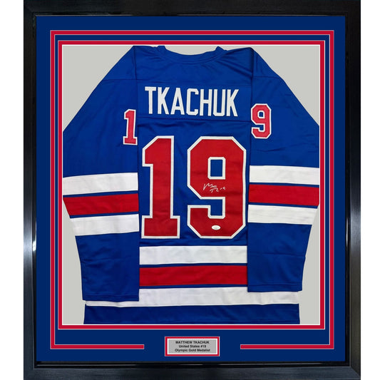 Framed Autographed/Signed Matthew Tkachuk 35x39 USA United States 2026 Olympics Gold Medal Blue Hockey Jersey JSA COA