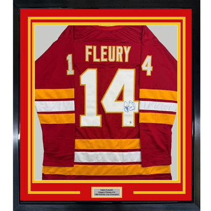 Framed Autographed/Signed Theo Fleury 35x39 Calgary Red Hockey Jersey Beckett BAS COA