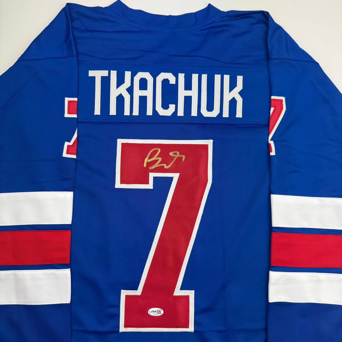 Autographed/Signed Brady Tkachuk USA United States 2026 Olympics Gold Medal Blue Hockey Jersey JSA COA