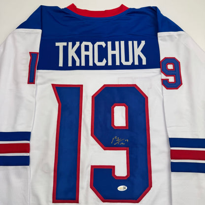Autographed/Signed Matthew Tkachuk USA United States 2026 Olympics Gold Medal White Hockey Jersey JSA COA