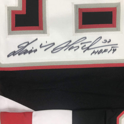 Framed Autographed/Signed Dominik Hasek HOF 14 33x42 Buffalo Black Hockey Jersey JSA COA