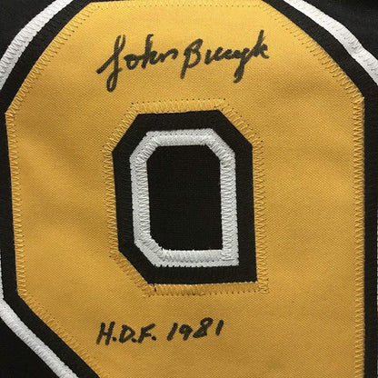 Framed Autographed/Signed John Johnny Bucyk HOF 1981 33x42 Boston Black Hockey Jersey JSA COA