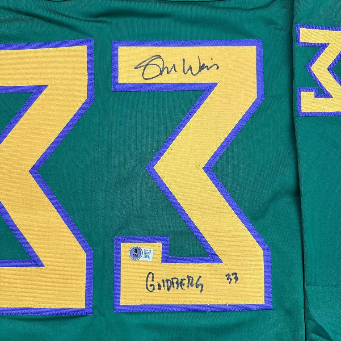 Framed Autographed/Signed Shaun Weiss Greg Goldberg 35x39 The Mighty Ducks Green Hockey Jersey Beckett BAS COA