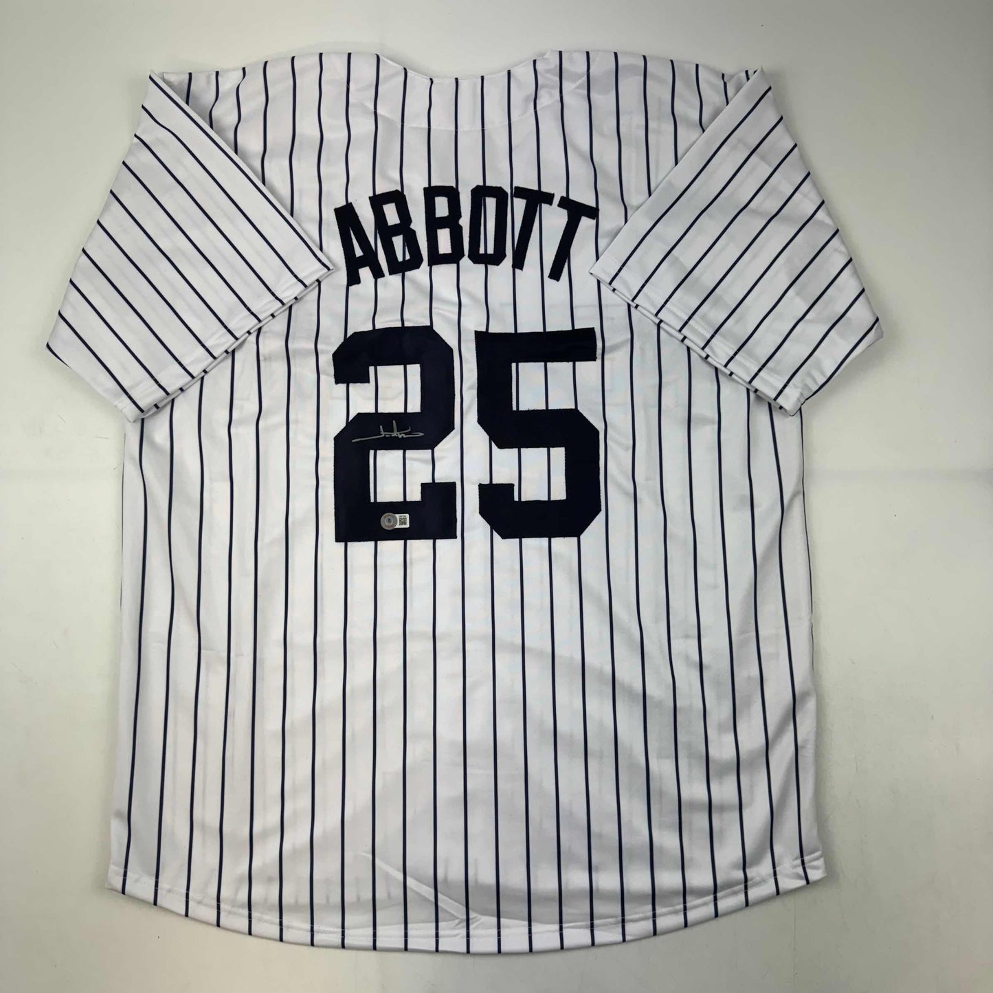 Autographed/Signed Jim Abbott New York White Pinstripe Baseball Jersey Beckett BAS COA