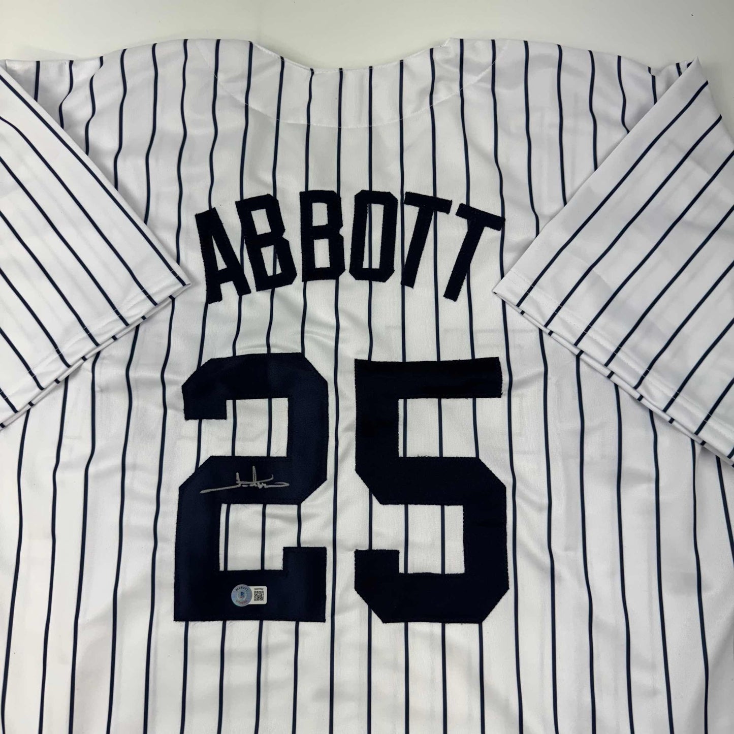 Autographed/Signed Jim Abbott New York White Pinstripe Baseball Jersey Beckett BAS COA