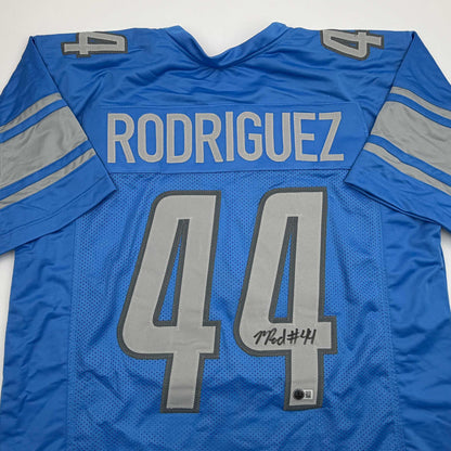 Autographed/Signed Malcolm Rodriguez Detroit Blue Football Jersey Beckett BAS COA
