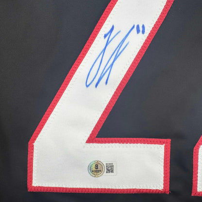 Autographed/Signed Logan Stankoven Carolina Black Hockey Jersey Beckett BAS COA