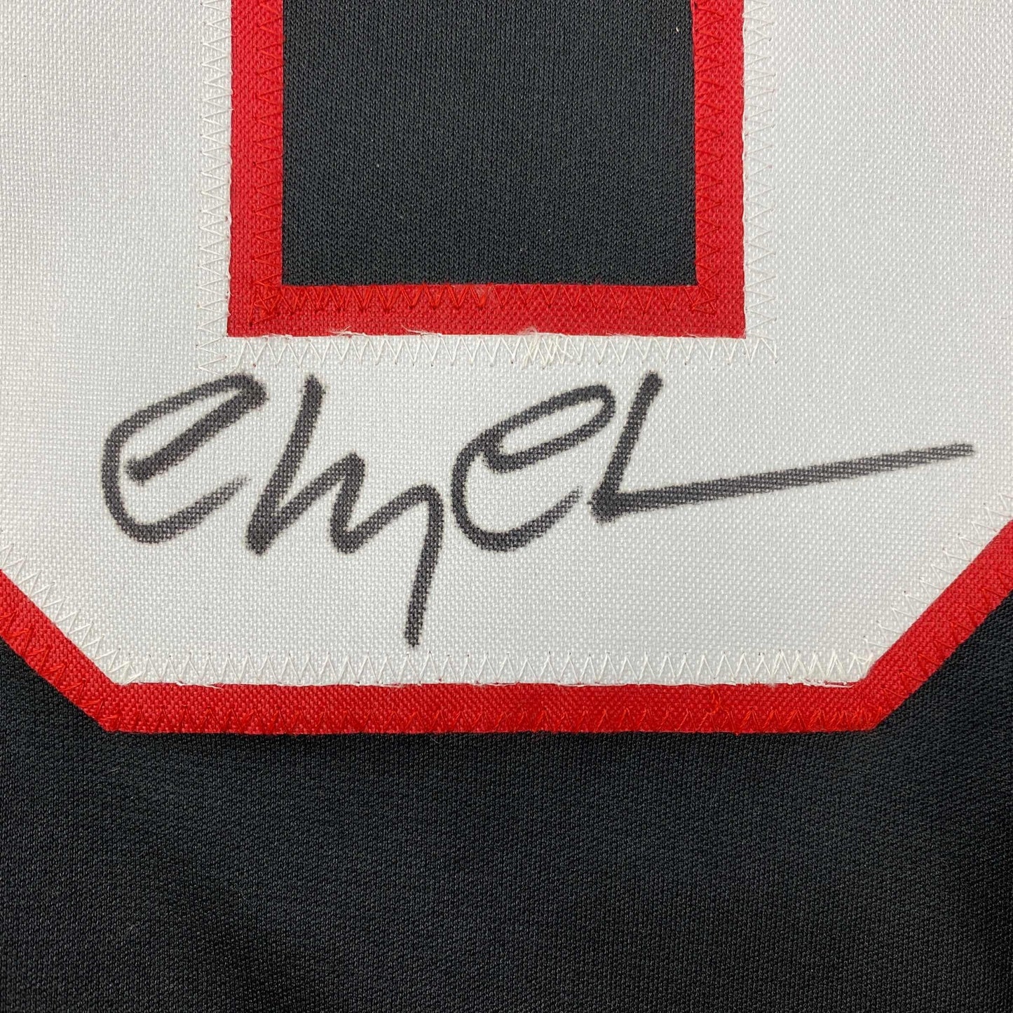 Autographed/Signed Chevy Chase Clark Griswold Christmas Vacation Movie Chicago Black Hockey Jersey Beckett BAS COA