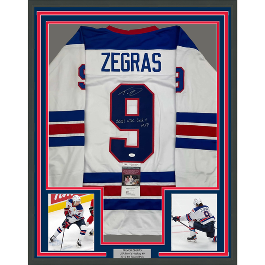 Framed Autographed/Signed Trevor Zegras 2021 WJC Gold & MVP 35x39 Team USA White Hockey Jersey JSA COA