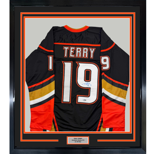 Framed Autographed/Signed Troy Terry 35x39 Anaheim Black Hockey Jersey Beckett BAS COA