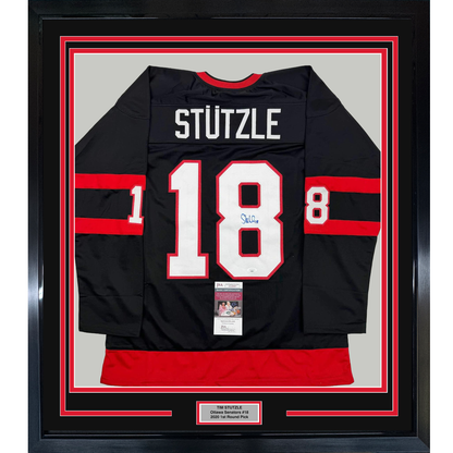 Framed Autographed/Signed Tim Stutzle 35x39 Ottawa Black Hockey Jersey JSA COA