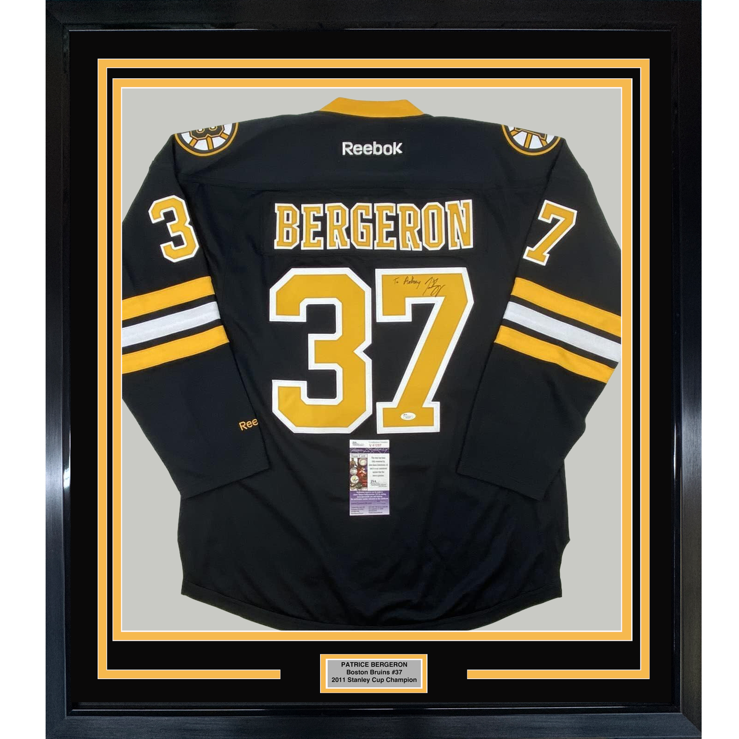 Framed Autographed/Signed Patrice 35x39 Bergeron Personalized To Anthony Boston Bruins Black Hockey Jersey JSA COA