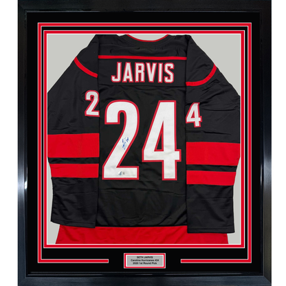 Framed Autographed/Signed Seth Jarvis 35x39 Carolina Black Hockey Jersey Beckett BAS COA