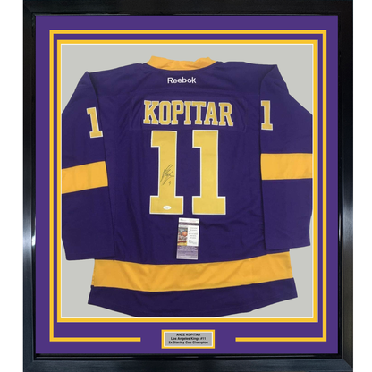 Framed Autographed/Signed Anze Kopitar 35x39 Los Angeles LA Retro Purple Hockey Jersey JSA COA