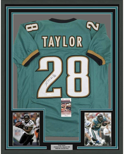 Framed Autographed/Signed Fred Taylor 35x39 Jacksonville Teal Football Jersey JSA COA