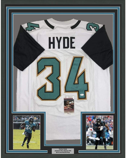 Framed Autographed/Signed Carlos Hyde 35x39 Jacksonville White Football Jersey JSA COA