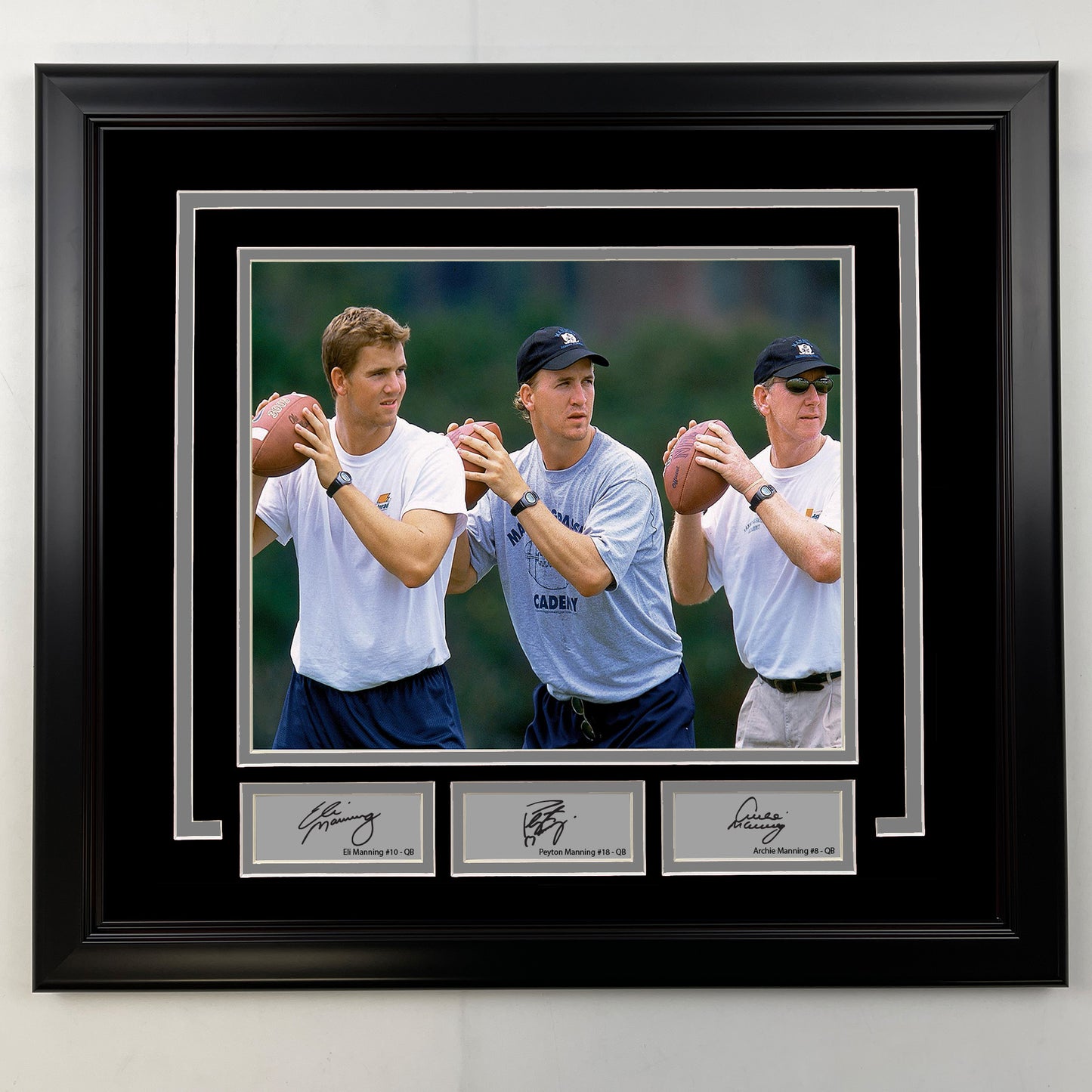 Framed Eli Manning, Peyton Manning and Archie Manning Facsimile Laser Engraved Signatures 19x21 Football Photo