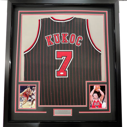 Framed Autographed/Signed Toni Kukoc 35x39 Chicago Black Pinstripe Basketball Jersey Beckett BAS COA